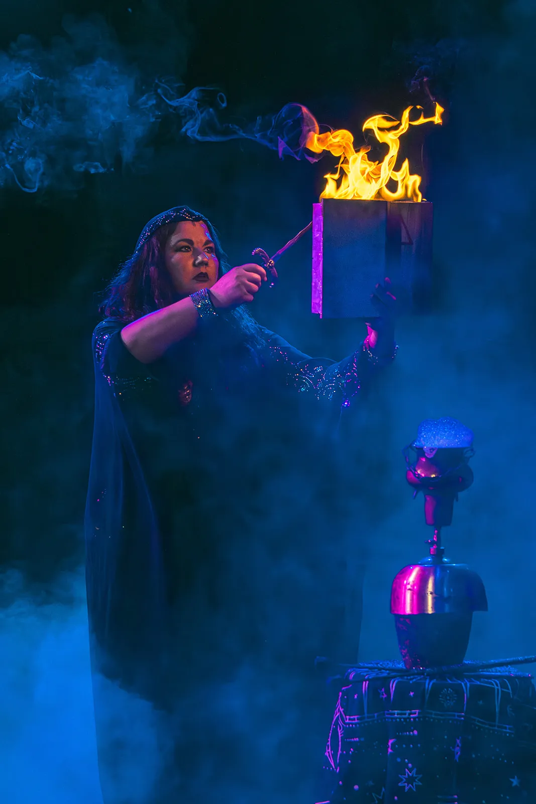 Ceremonial performance with fire and ritual book
