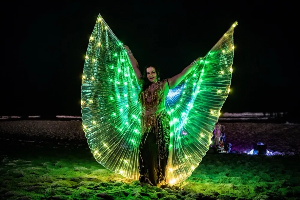 Lorenda performing with LED props